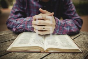 Picture of a person reading the bible for Lent