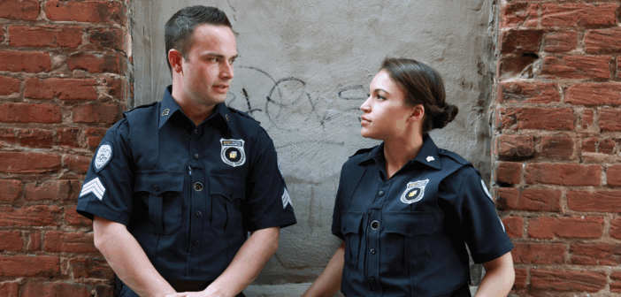 10 Ways to Strengthen Relations with Police and Public Safety Officials Two police officers having a conversation outside near the side of building