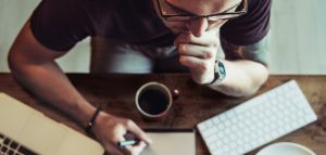 Photo of a person contemplating a website