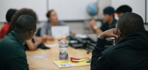 Photo of people meeting around a conference table