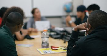 Photo of people meeting around a conference table