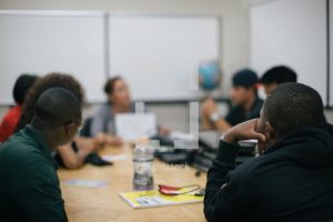 People gathered around a table in a meetingroom