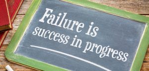 Chalk drawing of "Failure is success in progress"