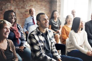 Photo of a diverse group of individuals in a gathering