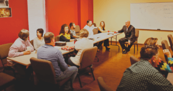 50 Ways To Strengthen Adult Education People in discussion at tables in a Sunday school class