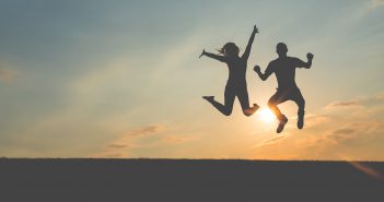 Photo of people jumping for joy