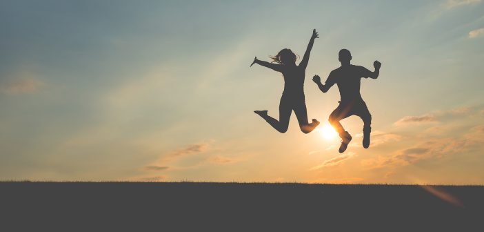 Photo of people jumping for joy