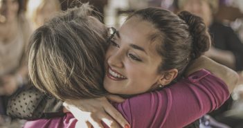 Photo of two people sharing a warm hug