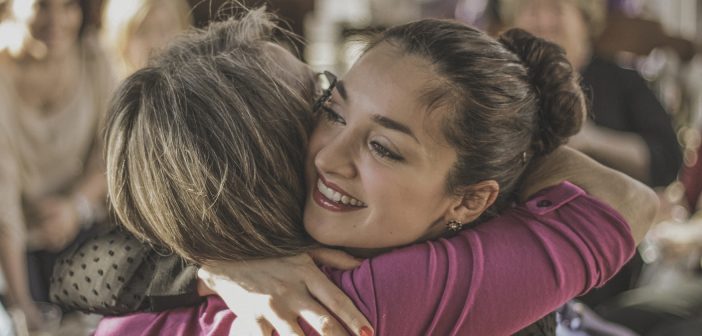 Photo of two people sharing a warm hug