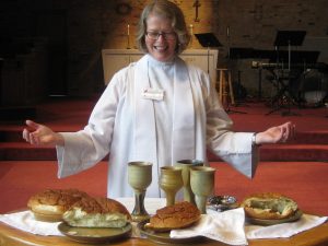 Photo of pastor at the communion table