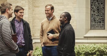 Photo of four people having a conversation