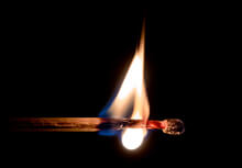 Photo of a lit matchstick
