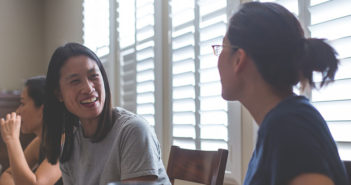 Two people engaged in conversation