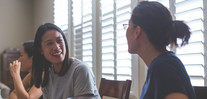 Two people engaged in conversation