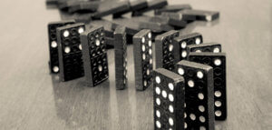 Dominoes precipitously lined up and ready to fall