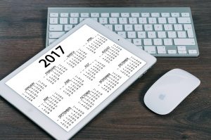 Photo of a calendar for 2017 on a desk with a computer keyboard.