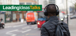 Person with headphone walking in the city