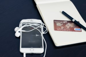 Photo of a smart phone and a credit card.