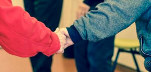 Closeup of two clasped hands