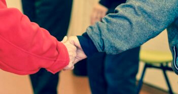 Closeup of two clasped hands