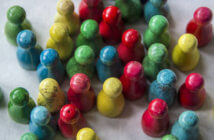 5 Reasons Churches Suffer Management Chaos Colored wooden pegs representing people and relationships