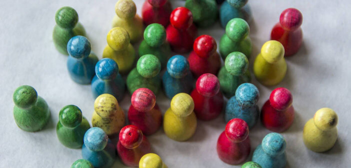 Colored wooden pegs representing people and relationships