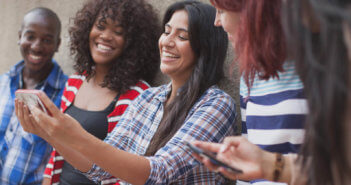 Diverse group of millennials taking a selfie