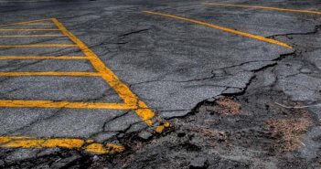 Photo of a cracked parking lot by Matt Johnson at https://ow.ly/iPrX30jQ6ne