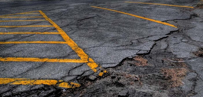 Photo of a cracked parking lot by Matt Johnson at https://ow.ly/iPrX30jQ6ne