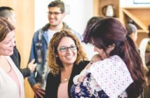 Honoring the Context of a New Ministry Setting Groups of people chatting after church, including one holding an infant