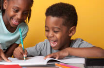 4 Tips for Launching a Church-School Partnership Smiling kids writing in a notebook