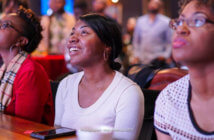 Engaging Young Adults Through Innovation Engaged young adults at a worship service sitting at a table with their cellphones before them -- Photographer: Matt Anderson 2015
