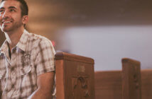 Welcoming Change Begins with You Smiling, attentive person sitting in a pew