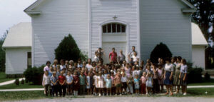 Vintage group photo of a congregation out front of the old Dawson Baptist Church in Philpot, Ky.
