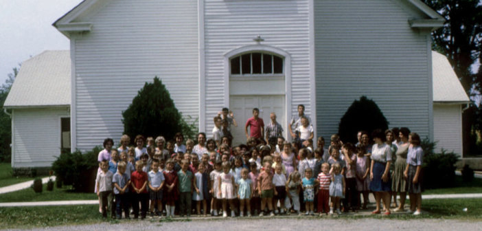 Vintage group photo of a congregation out front of the old Dawson Baptist Church in Philpot, Ky.