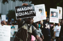 5 Things to Consider Before Engaging a Public Issue People at a protest march holding up signs