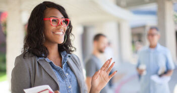 Friendly person welcoming others to worship