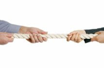 Leaders Learn to Work with Difficult People Two people pulling on a rope in a tug-of-war