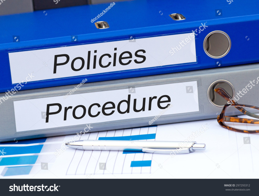 stockphotopoliciesandproceduretwobindersondeskintheoffice297293312 Lewis Center