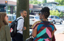 4 Key Practices of Community Engagement People chatting on a sidewalk in town