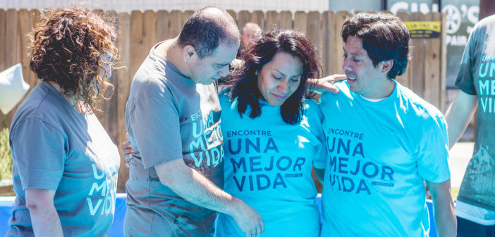 Outdoor baptism in a swimming pool