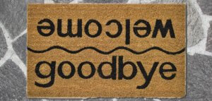 Floor mat that reads goodbye on one side and welcome on the other