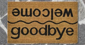 Floor mat that reads goodbye on one side and welcome on the other