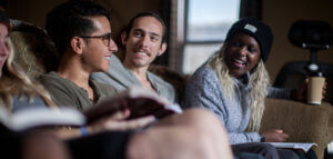 Young adults on a couch having Bible study