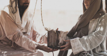 The Samaritan woman giving Jesus a drink of water from the well.