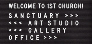 Felt letter board pointing the way to the sanctuary, art studio, gallery, and office