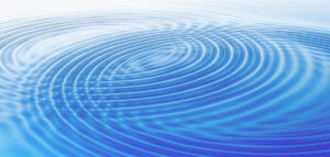 Growing wave rings in blue water