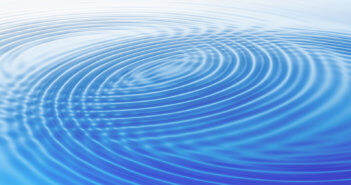 Growing wave rings in blue water