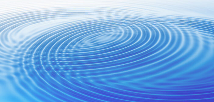 Growing wave rings in blue water