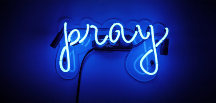 Pray written in neon